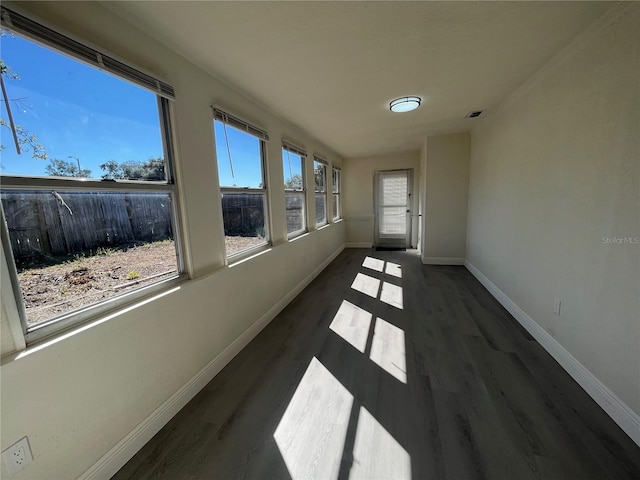 unfurnished sunroom with a wealth of natural light