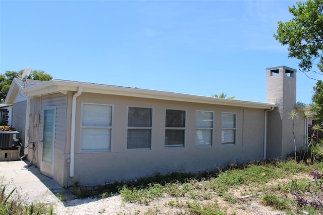 view of home's exterior featuring cooling unit