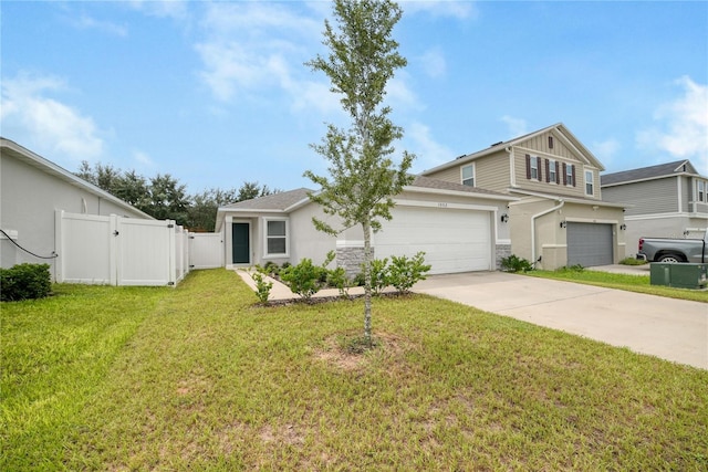 view of front facade with a garage and a front yard