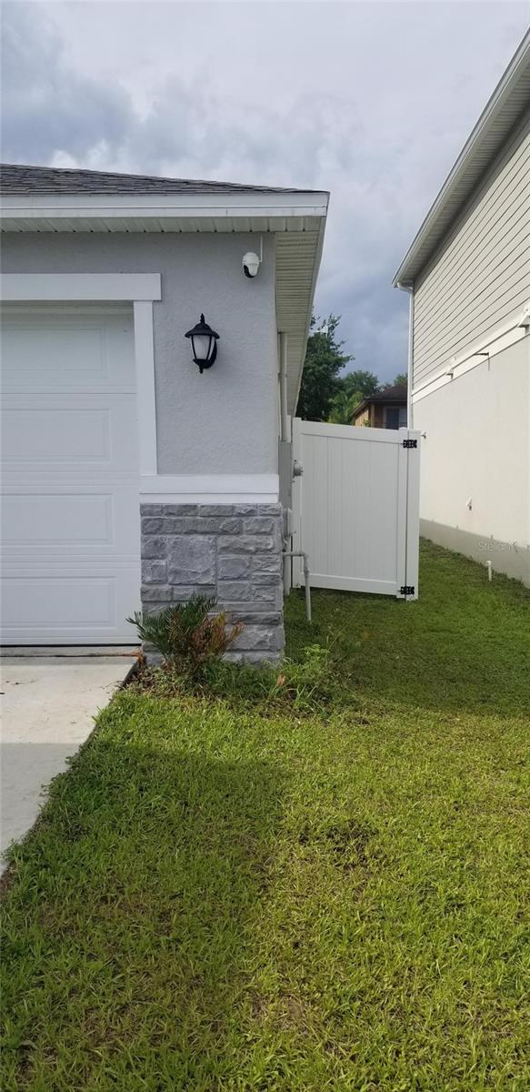 exterior space featuring a yard and a garage