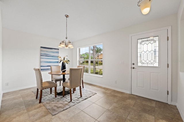 dining space featuring a chandelier