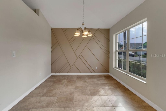 unfurnished dining area with a wealth of natural light and a notable chandelier