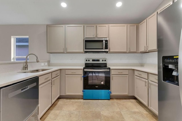 kitchen with sink and appliances with stainless steel finishes