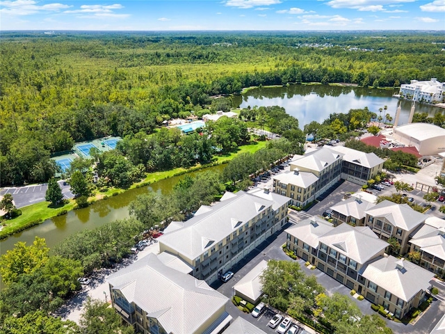 aerial view featuring a view of trees and a water view
