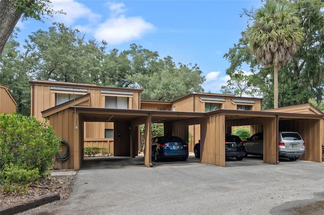 view of parking with a carport