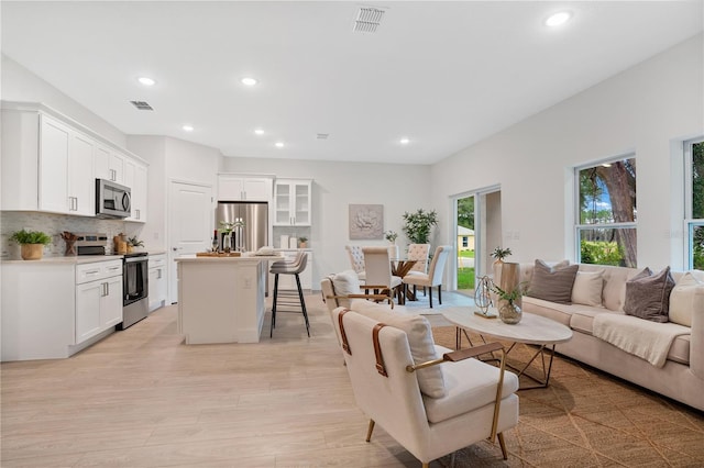 living room featuring light wood-type flooring