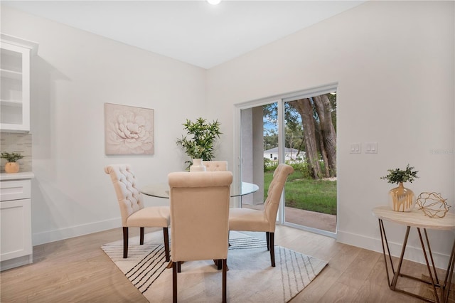 dining area with light wood-type flooring