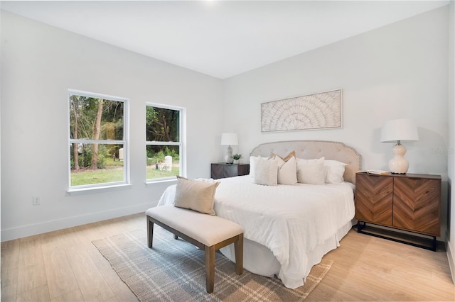 bedroom with light wood-type flooring