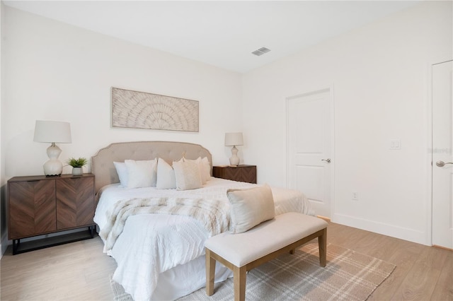 bedroom with light hardwood / wood-style flooring