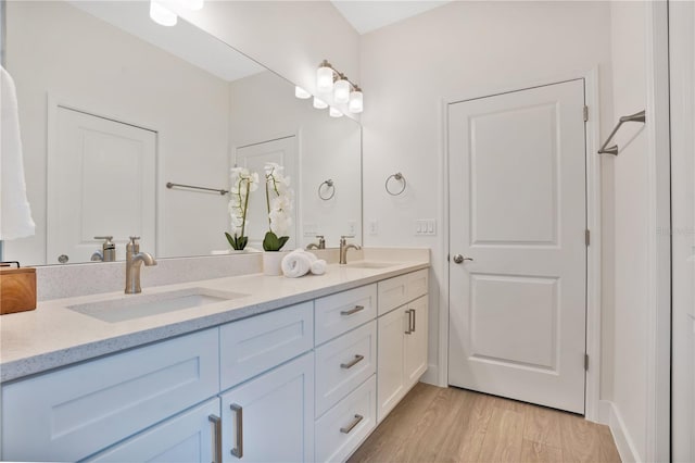 bathroom featuring vanity and hardwood / wood-style floors