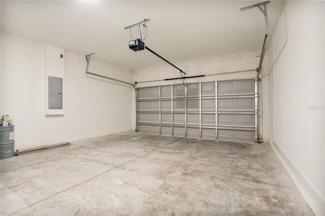 garage featuring a garage door opener and electric panel