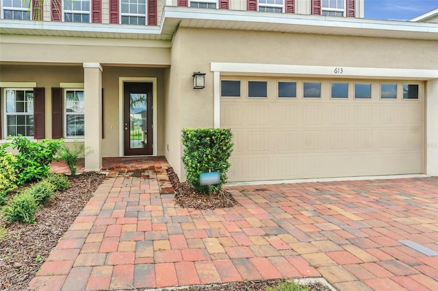 doorway to property featuring a garage