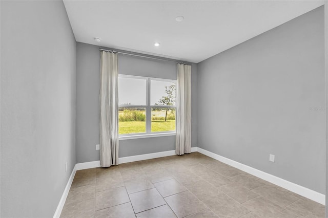 spare room with light tile patterned floors