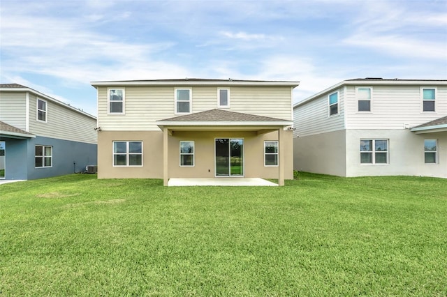 back of house featuring a patio, cooling unit, and a yard