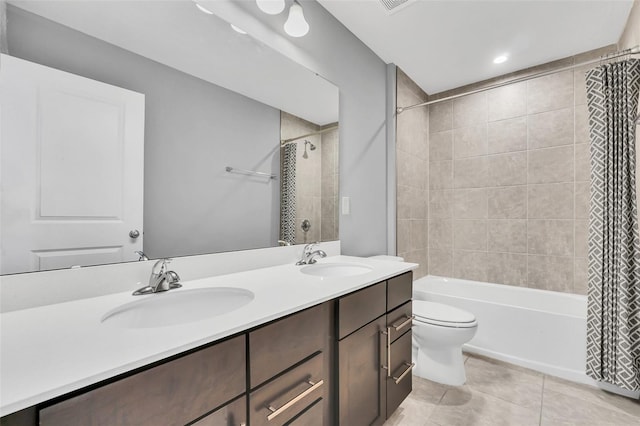 full bathroom with toilet, tile patterned flooring, vanity, and shower / tub combo