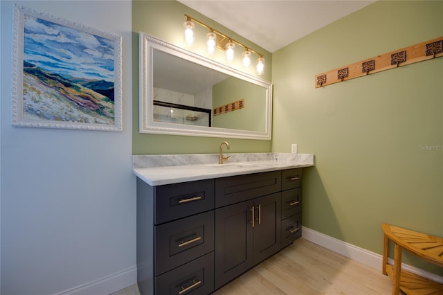 bathroom featuring vanity and hardwood / wood-style floors