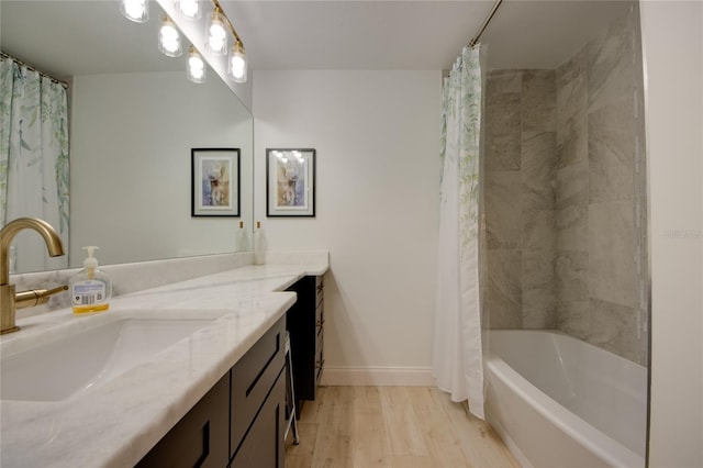 bathroom featuring vanity, hardwood / wood-style flooring, and shower / bath combo with shower curtain