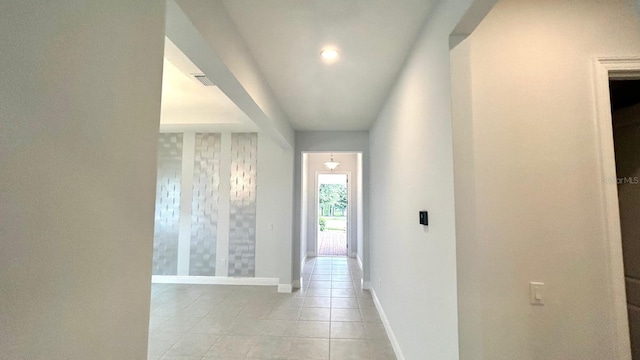 corridor featuring light tile patterned flooring