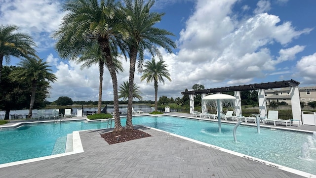 view of swimming pool with a patio and pool water feature