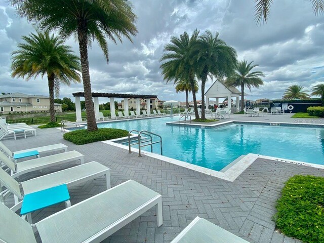 view of swimming pool featuring a patio area