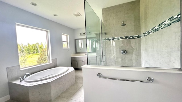 bathroom featuring vanity, tile patterned floors, and independent shower and bath