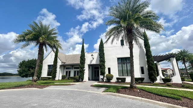 view of front of home with a water view