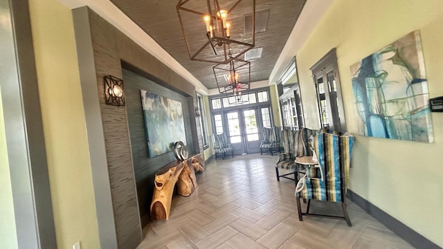 interior space with parquet flooring, an inviting chandelier, french doors, and wood ceiling