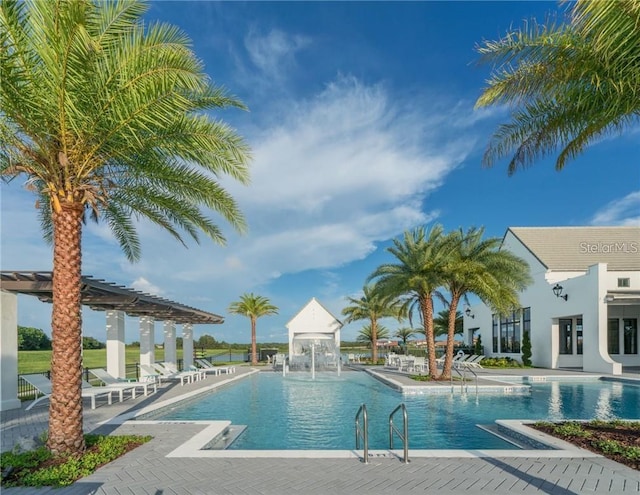 view of swimming pool featuring a patio area and pool water feature