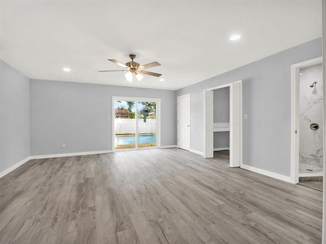 unfurnished room with ceiling fan and light hardwood / wood-style floors