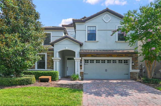 view of front of property with a garage