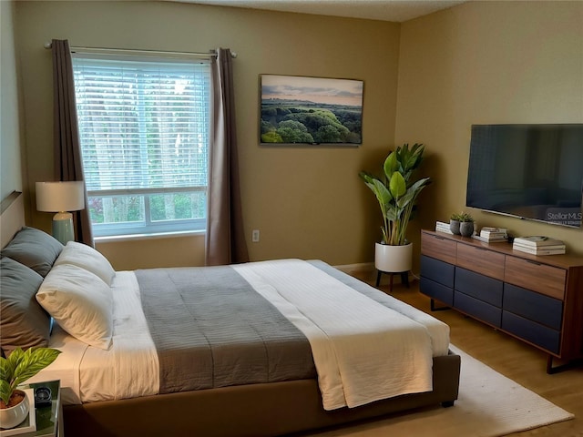 bedroom featuring wood-type flooring