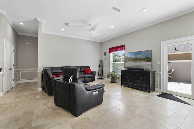 living room with crown molding and ceiling fan