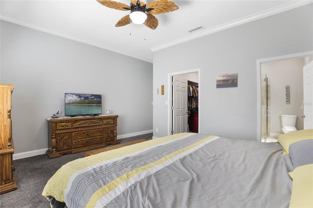 bedroom with crown molding, dark carpet, ensuite bath, and ceiling fan