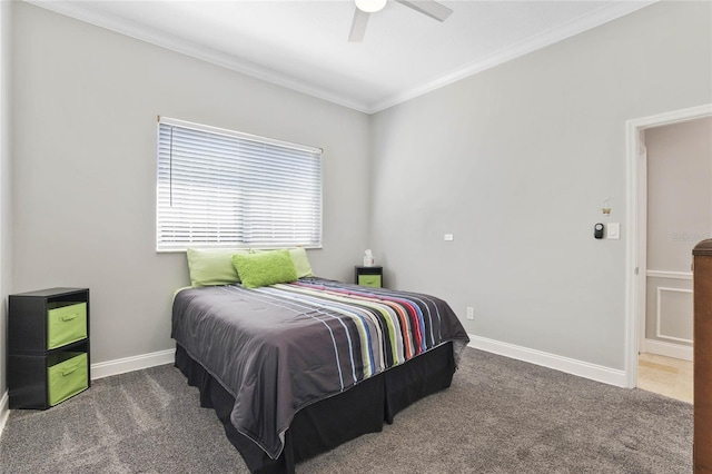 carpeted bedroom featuring crown molding and ceiling fan