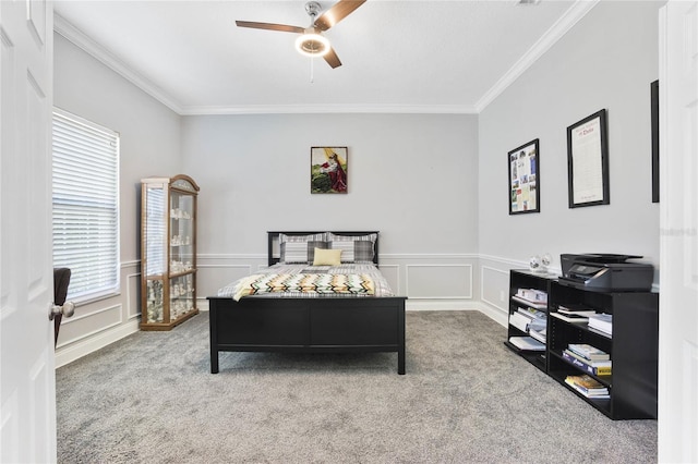 bedroom featuring crown molding, ceiling fan, and carpet flooring