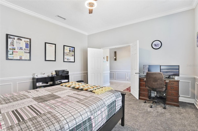 bedroom with crown molding, ceiling fan, and carpet flooring