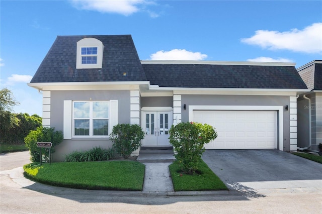 view of front of home with a garage and french doors