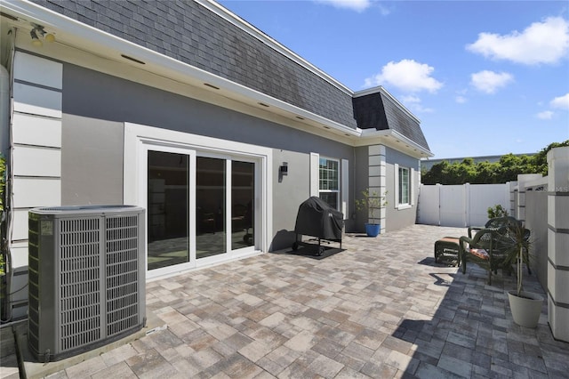 view of patio featuring central AC unit and grilling area