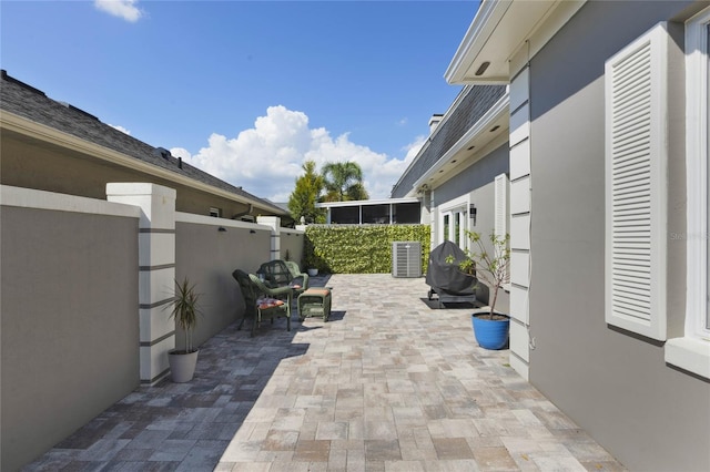 view of patio / terrace with a sunroom