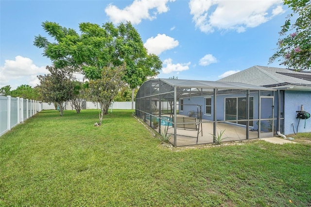 view of yard featuring a lanai, a fenced in pool, and a patio area