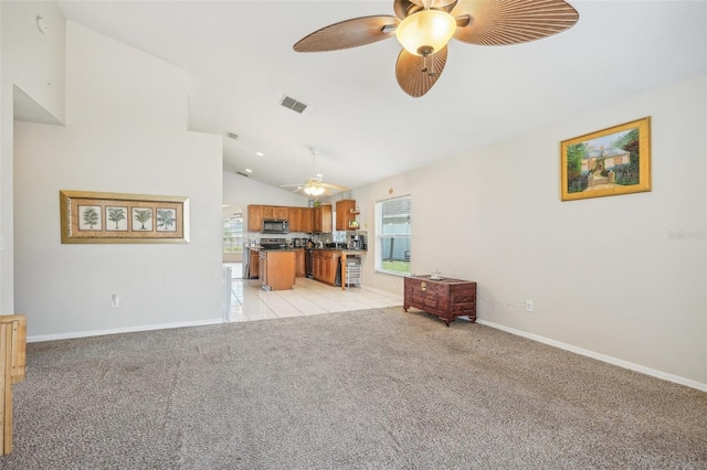 living room featuring lofted ceiling, light carpet, and ceiling fan