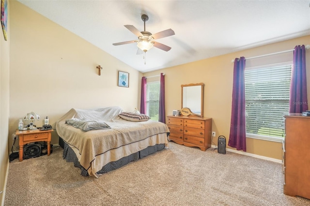 bedroom featuring ceiling fan, light colored carpet, and lofted ceiling