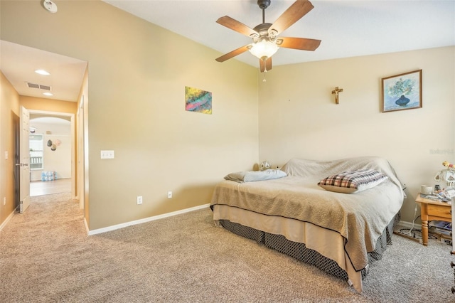 carpeted bedroom with ceiling fan