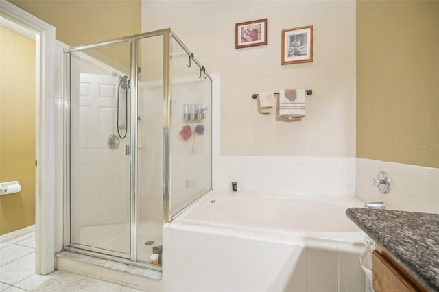 bathroom with shower with separate bathtub, tile patterned flooring, and vanity