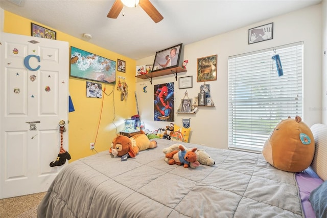 carpeted bedroom with ceiling fan