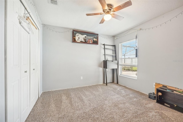 unfurnished bedroom with carpet and ceiling fan