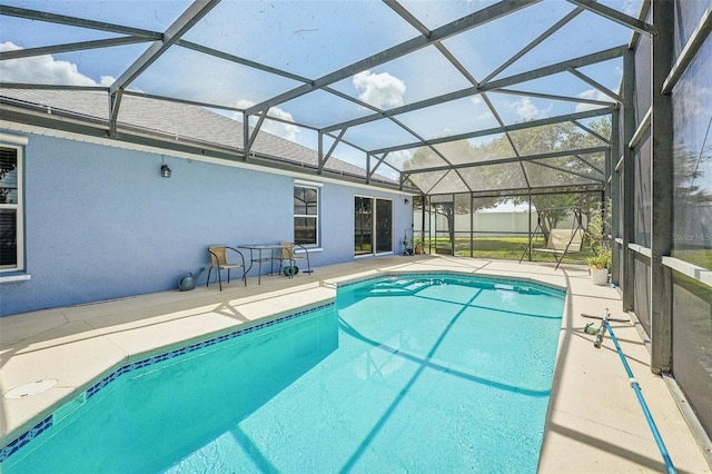 view of pool featuring a patio and a lanai