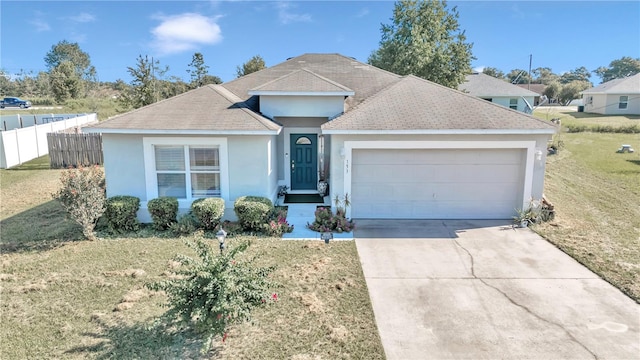 ranch-style house with a garage and a front yard