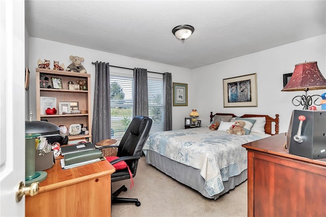 carpeted bedroom featuring a textured ceiling