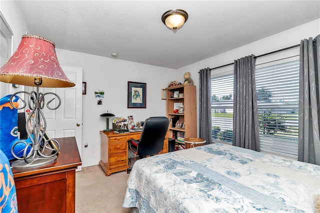 carpeted bedroom with a textured ceiling